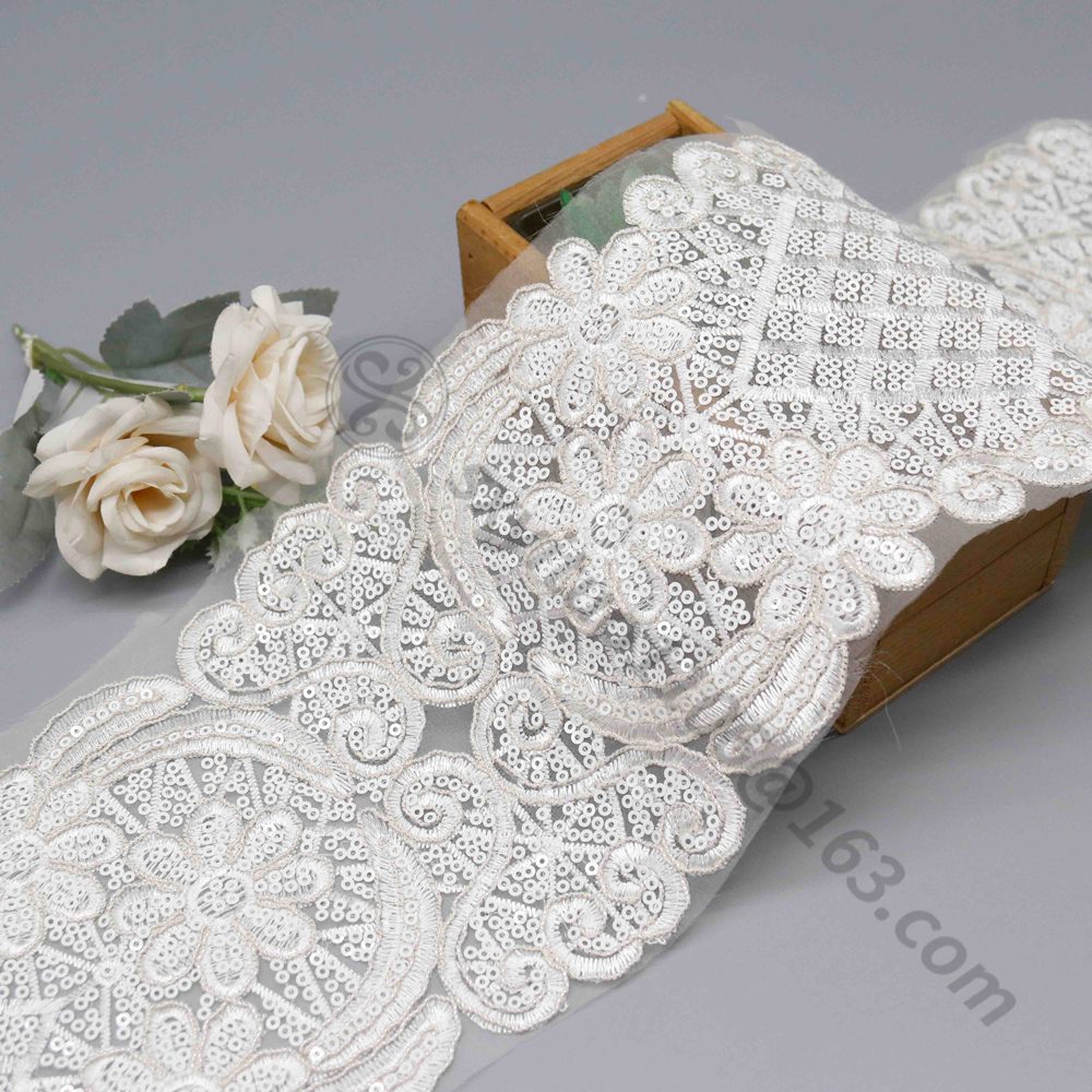 Artisan-crafted white lace trim, embellished with dazzling sequins and beads, measuring 14cm wide for wedding dress details and special DIY accents.