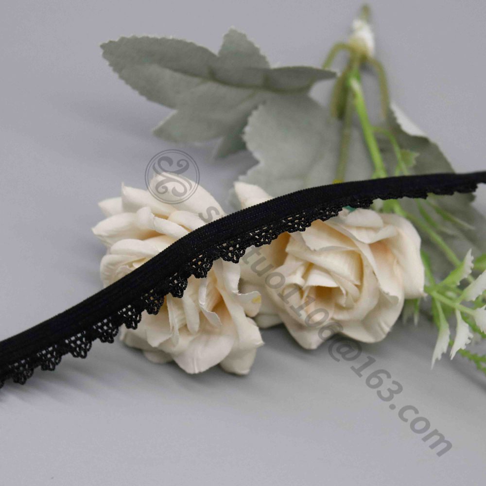 High-resolution image of narrow 1.1 cm black elastic lace trim