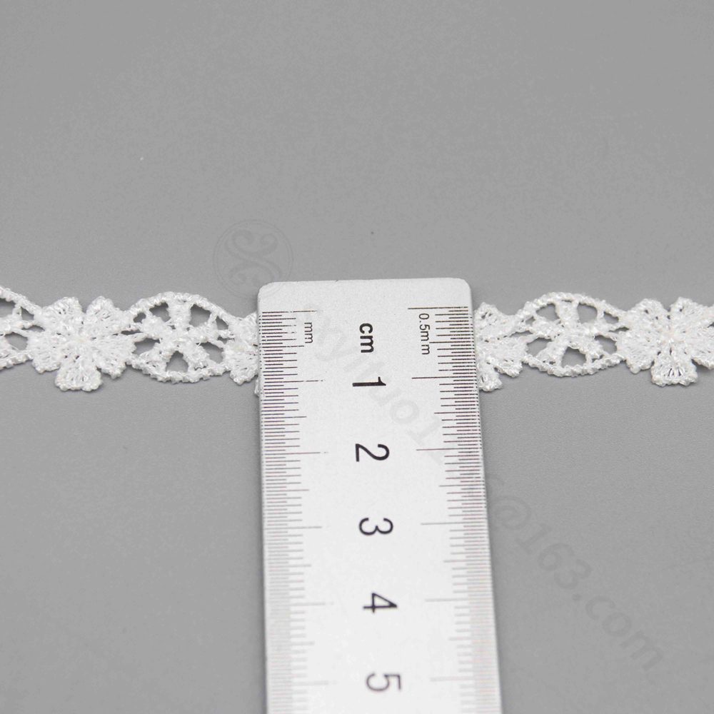 Artistic close-up of a fine water-soluble lace trim