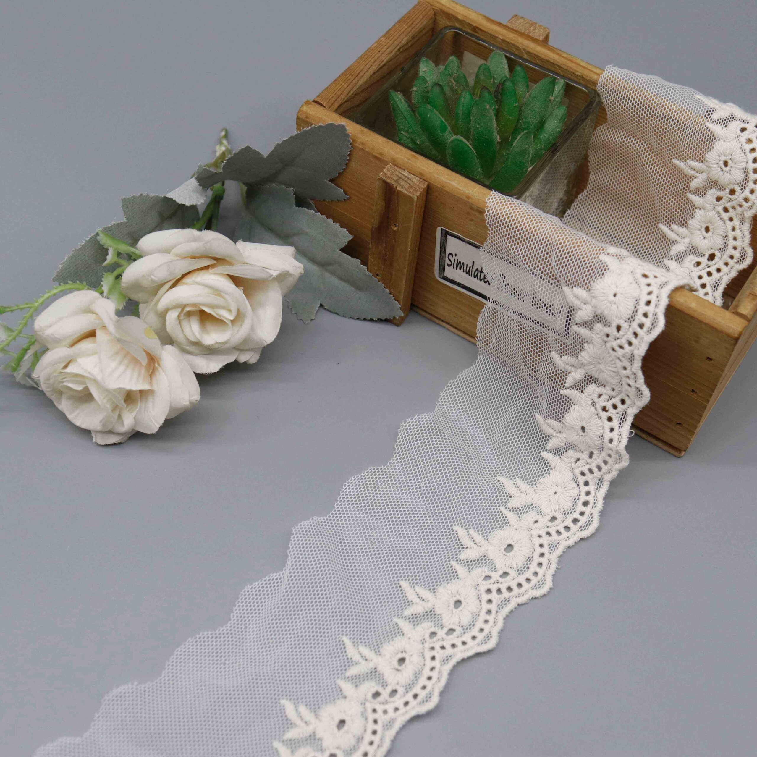 Front-facing shot of Daisy Garden Polyester Mesh Embroidery Lace Trim, showing floral motifs and sheer tulle ground clearly.