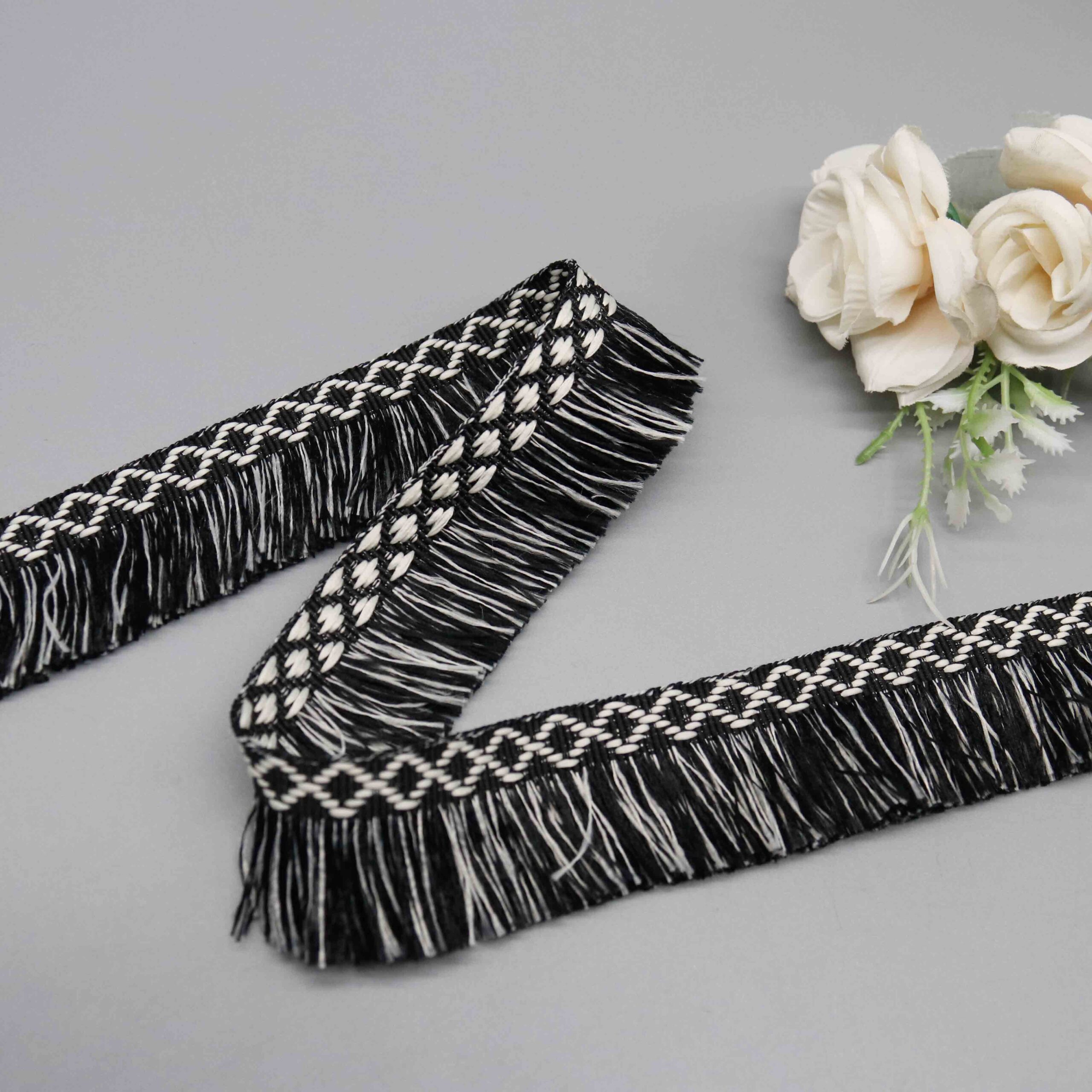 Angled shot capturing the matte polyester texture and woven lattice depth of the header band.