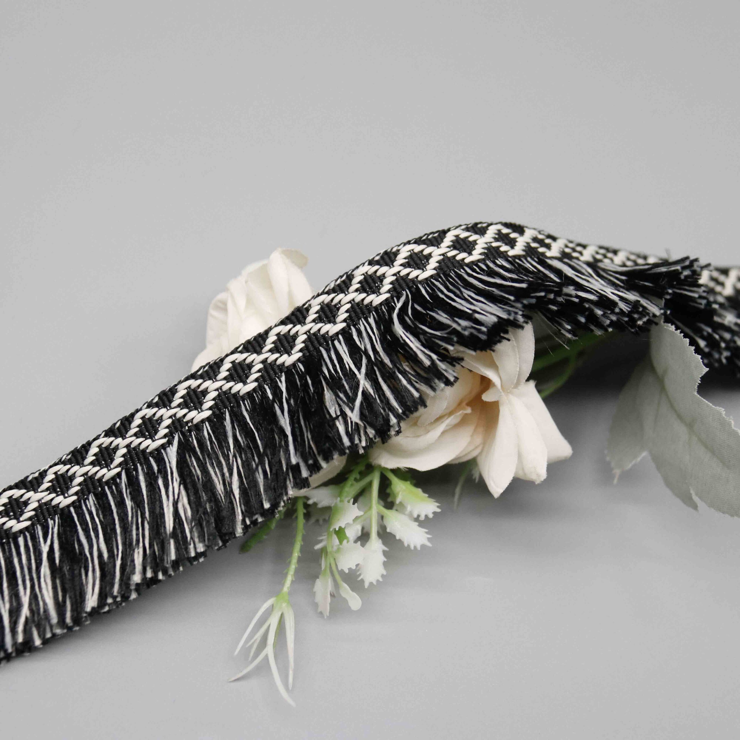 High-resolution detail showing the dense cut fringe strands and mixed color distribution.