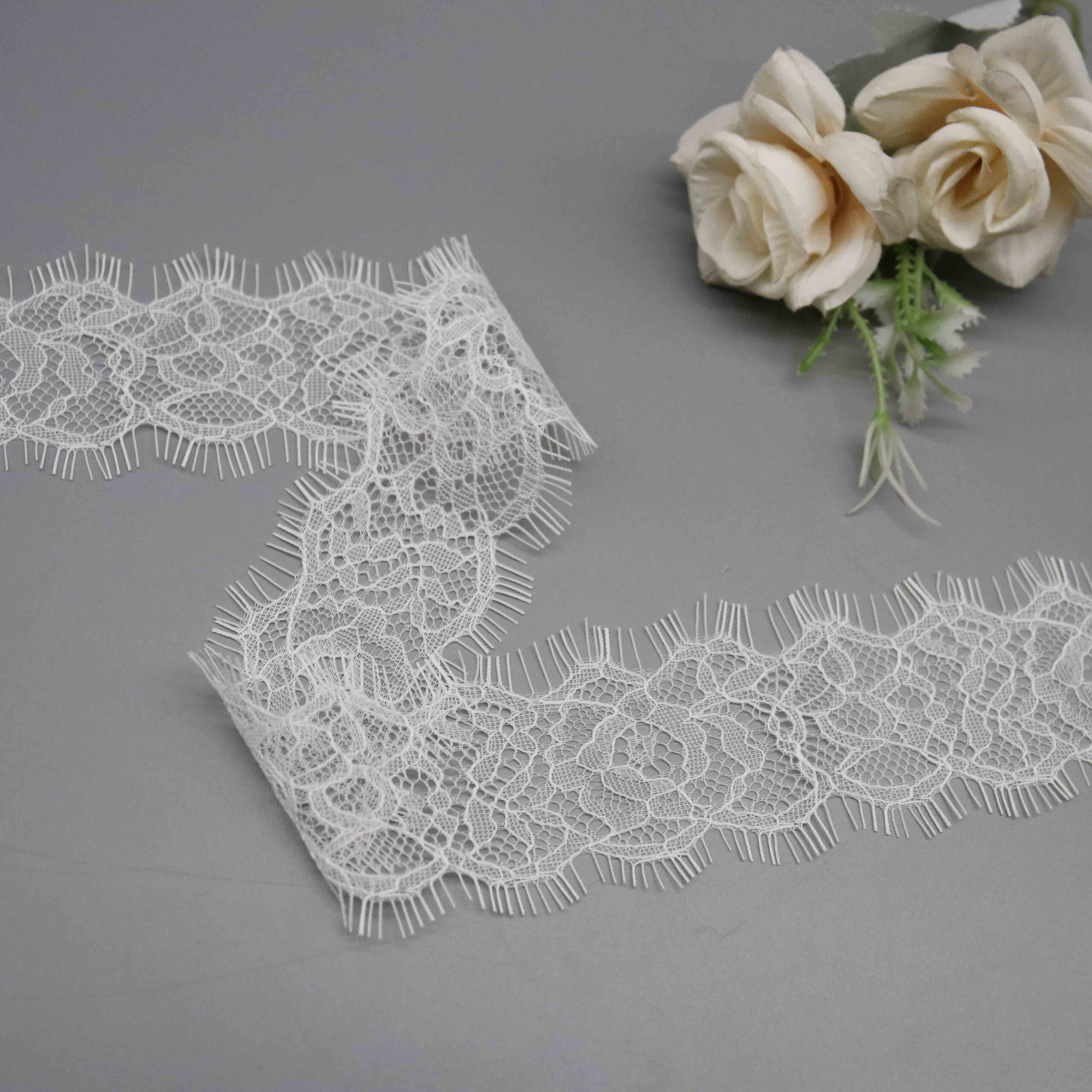 Angled view highlighting the sheer finish and silky tactile sensation of the fabric.
