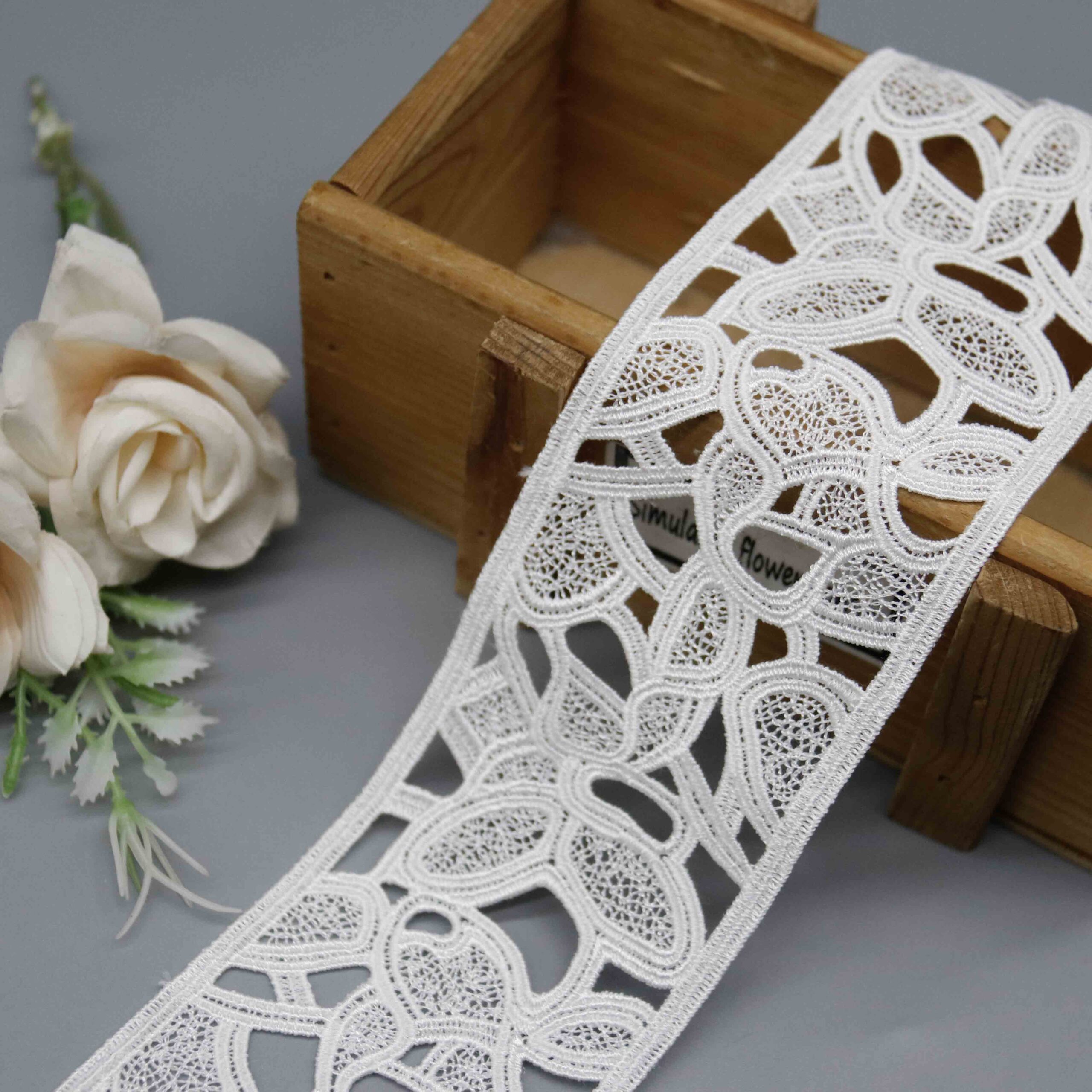 Front-facing shot showing the curved openwork pattern and smooth milk fiber texture clearly.