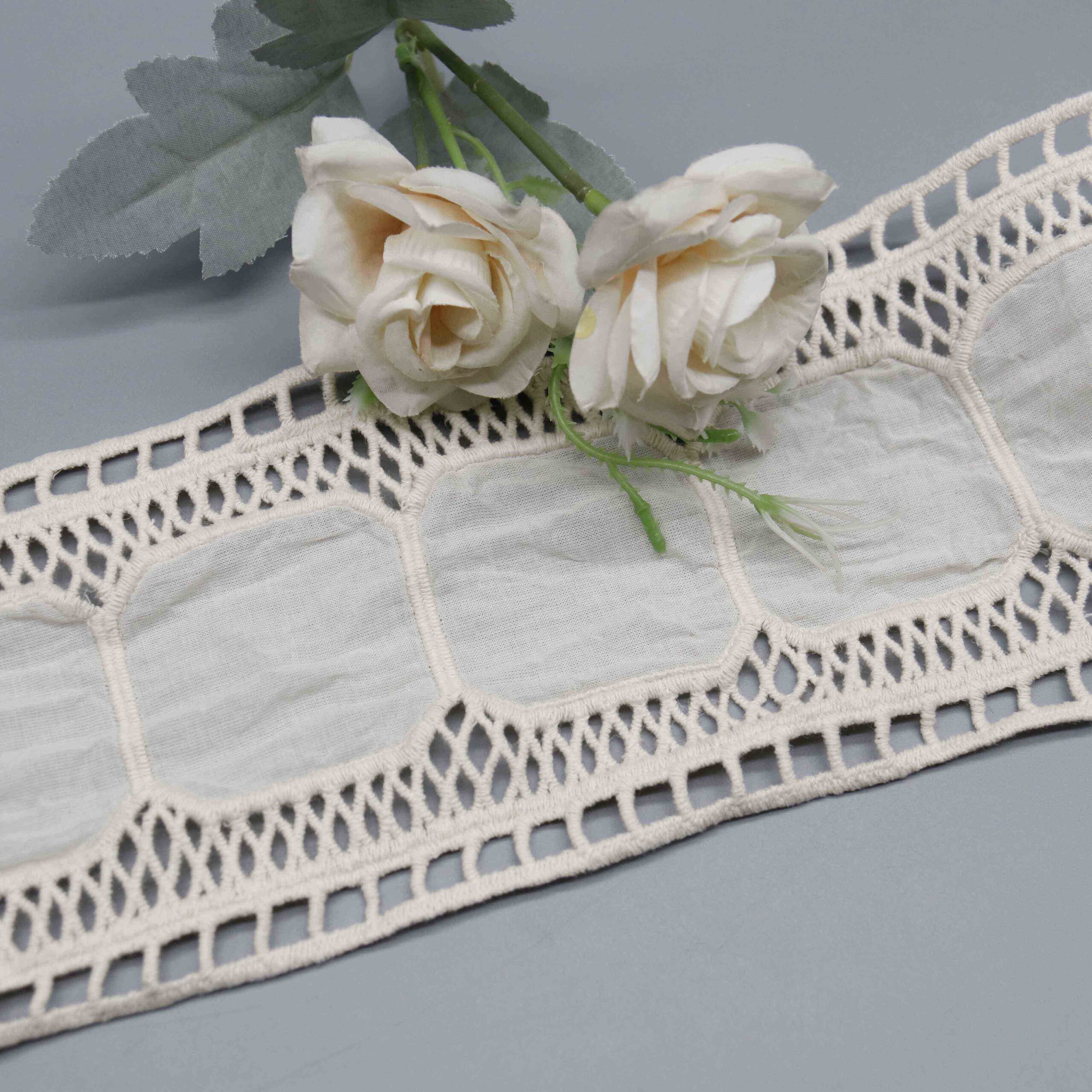 High-resolution focus on rectangular cutwork border construction and clean edge quality.