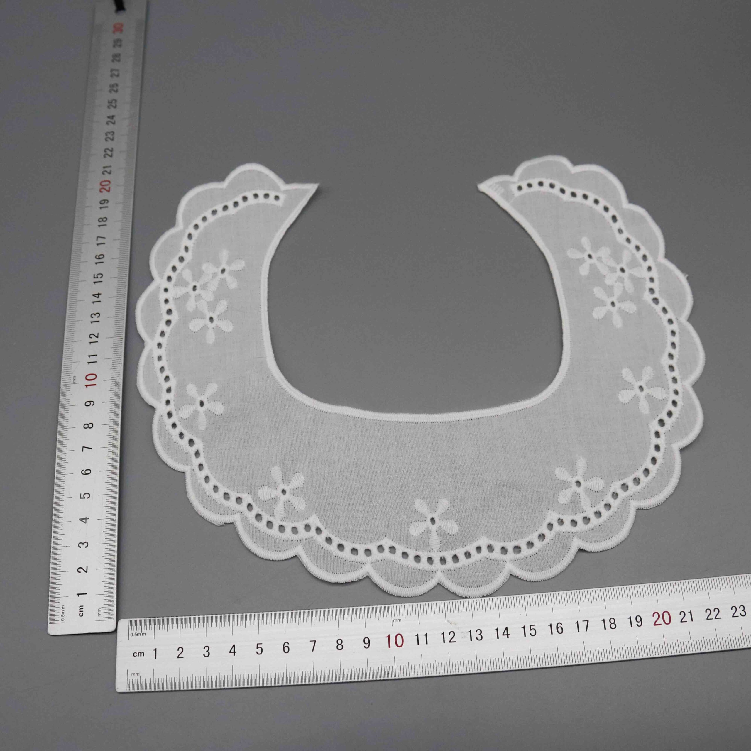 Backlit demonstration of openwork density and delicate see-through characteristics through fabric.