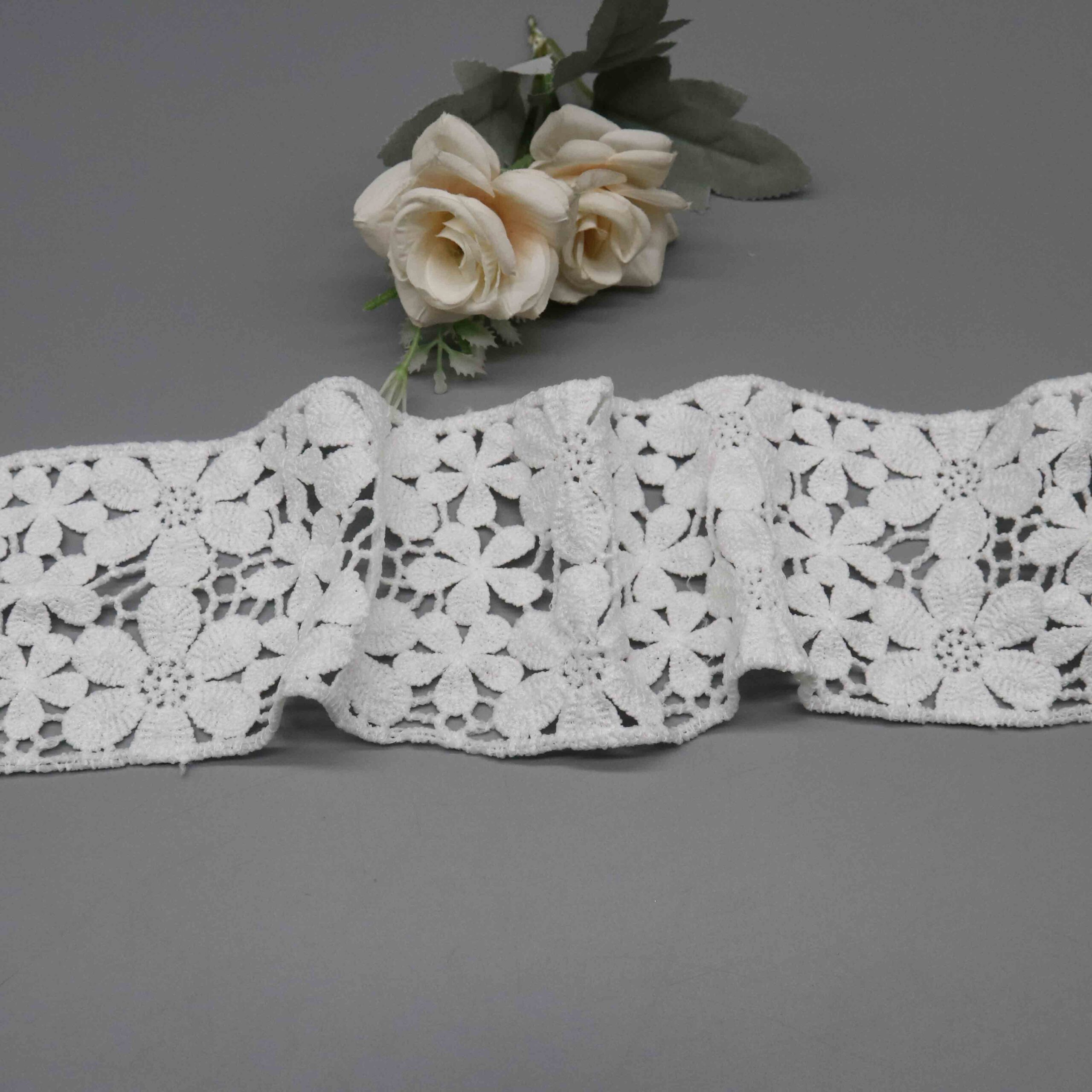 High-resolution focus on seamless botanical edge construction and honeycomb mesh ground quality.