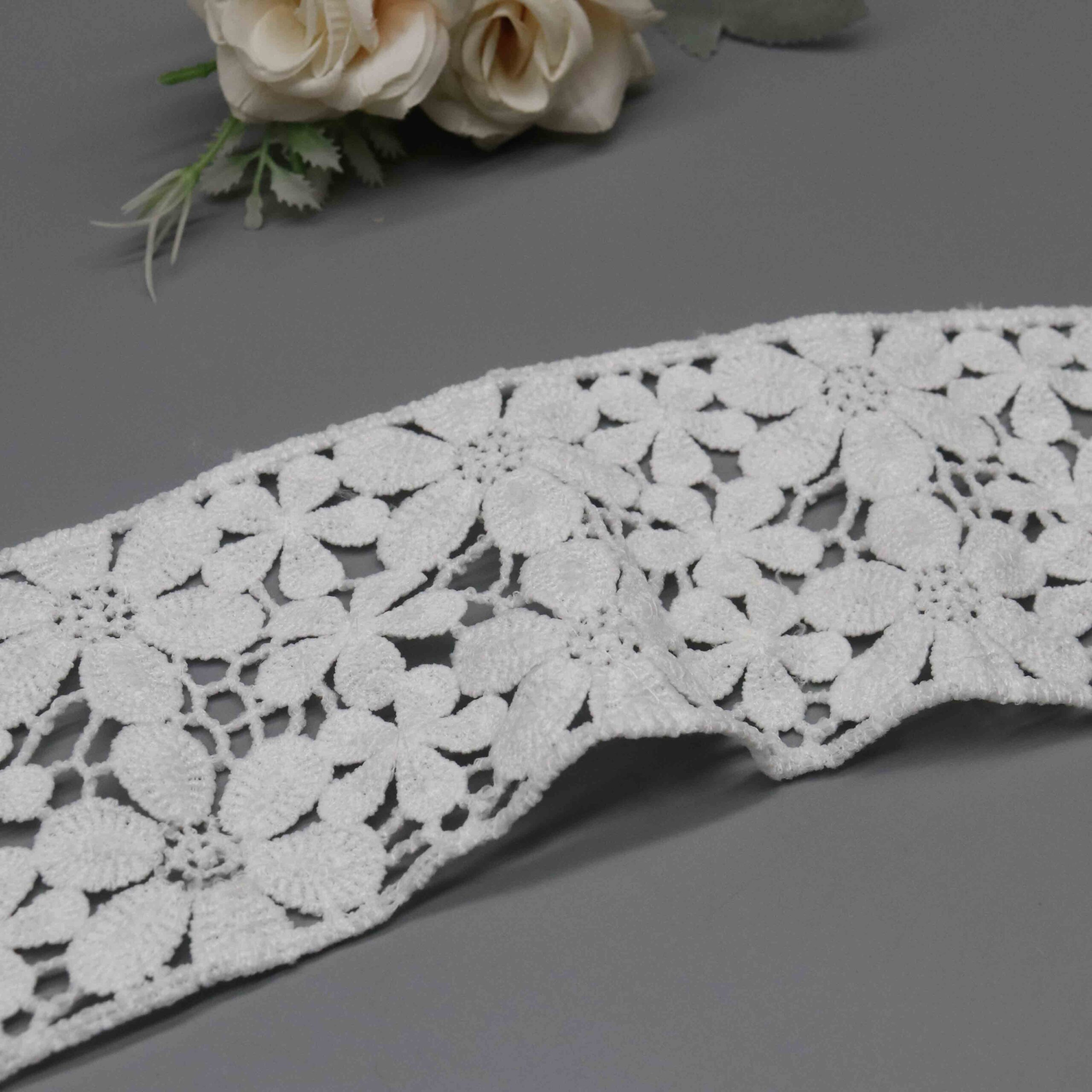Vertical sizing gauge displaying exact 8.5cm dimension of wide decorative ribbon.