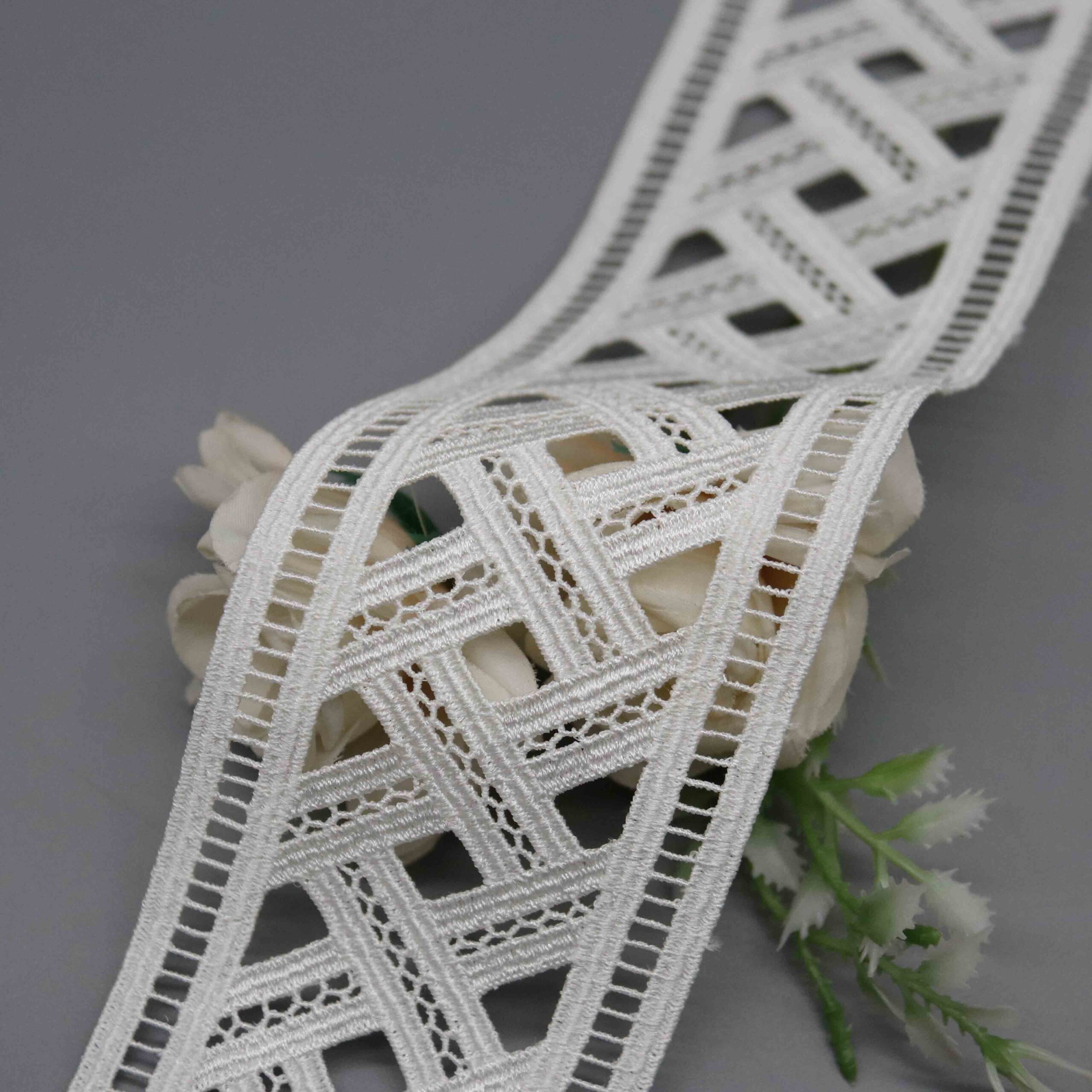 Front-facing shot showing the diagonal crosshatch pattern and silky milk fiber texture clearly.