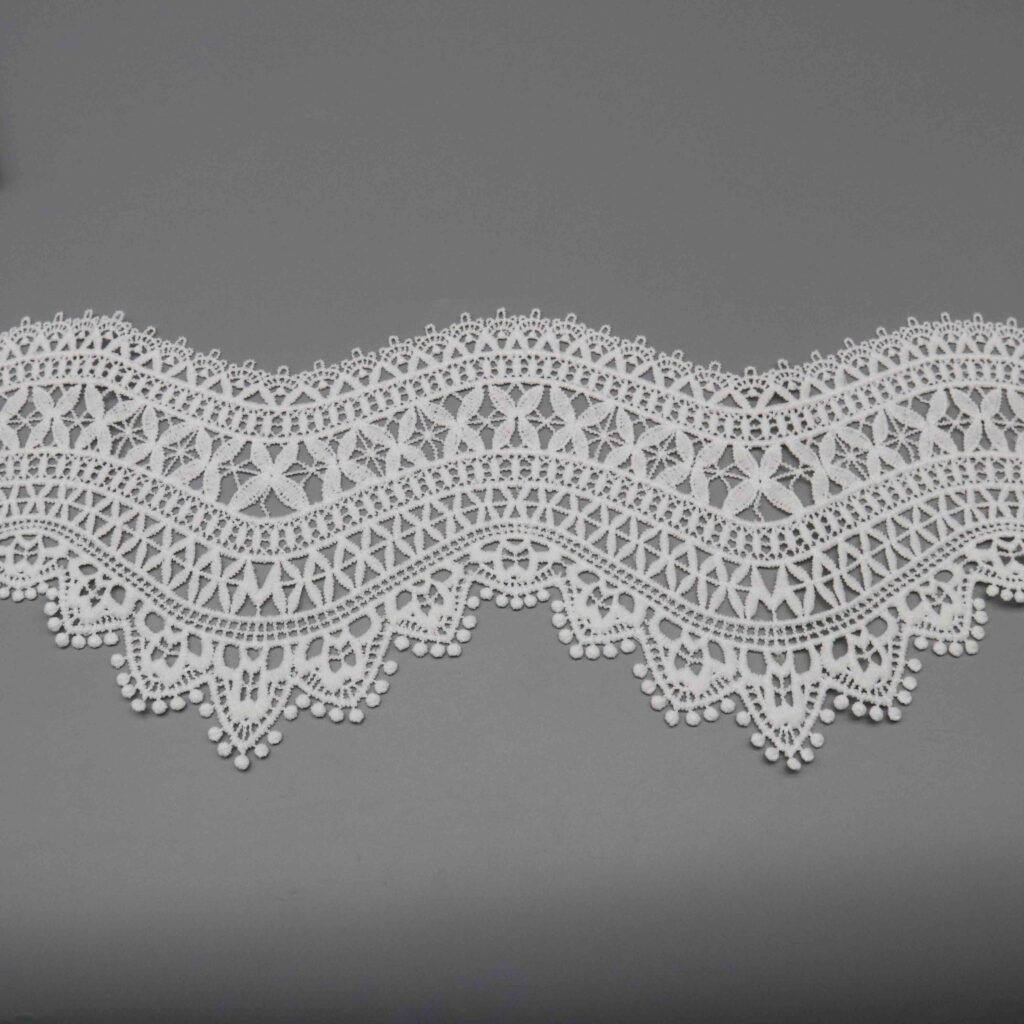 Macro close-up capturing intricate cross motifs and dimensional thread craftsmanship