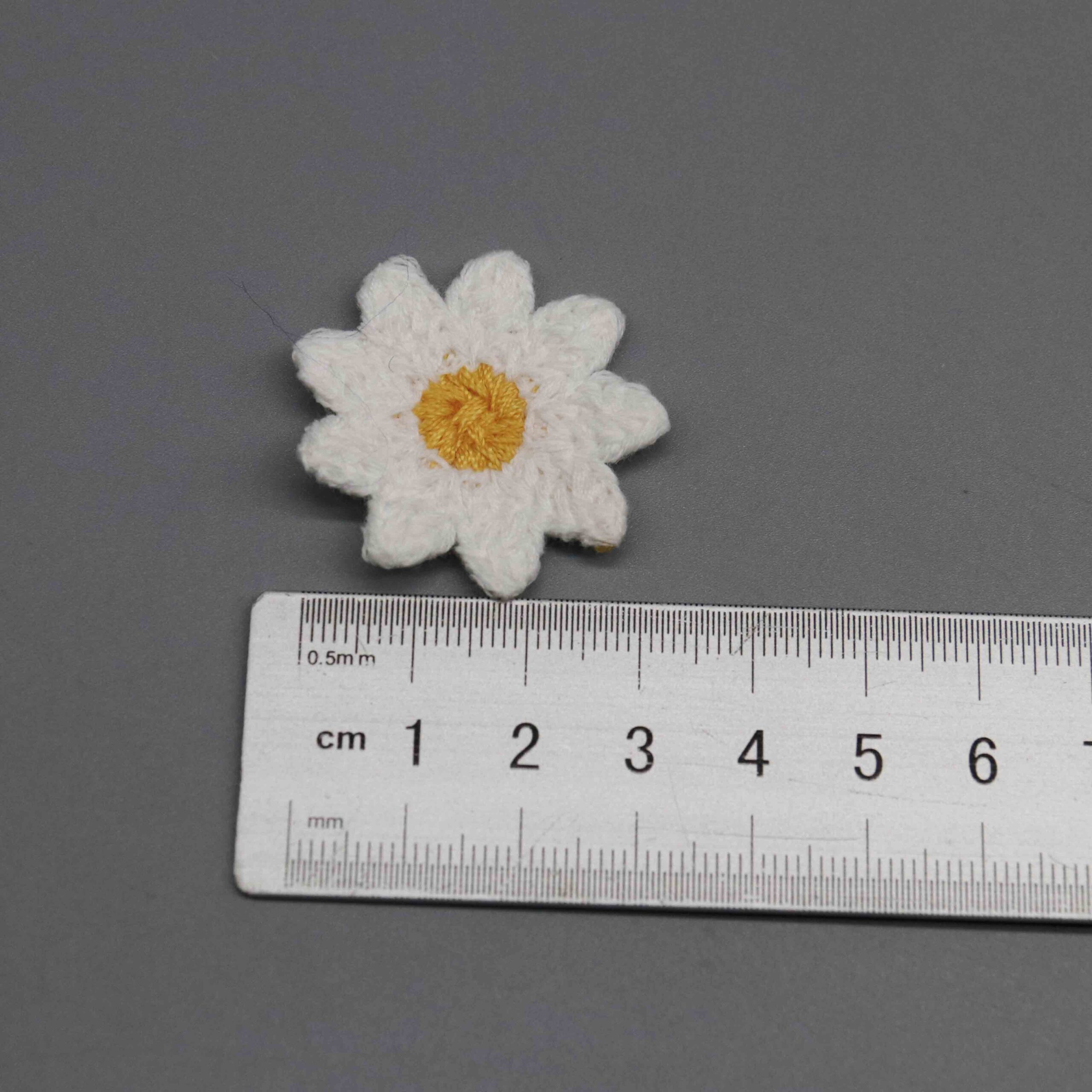Horizontal ruler placement illustrating 5.3cm diameter of large floral embellishment piece.