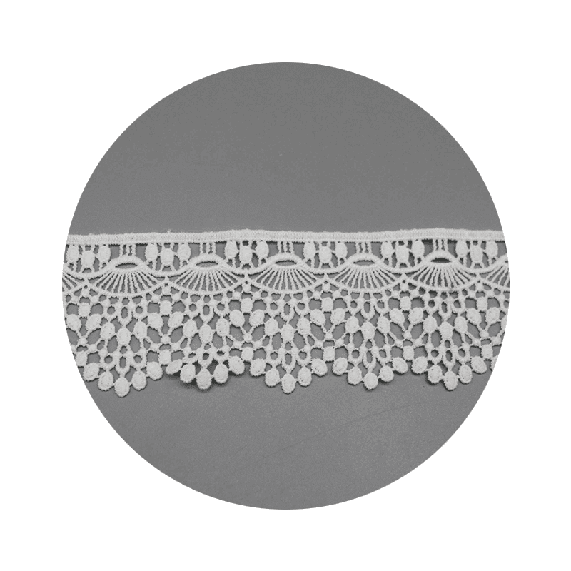 Macro close-up capturing the embroidery motif layout and fine thread precision.