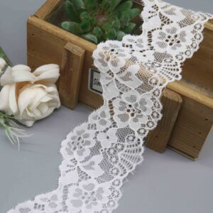 a 6.2cm wide stretch lace in white, showing its dense floral pattern and scalloped edge.
