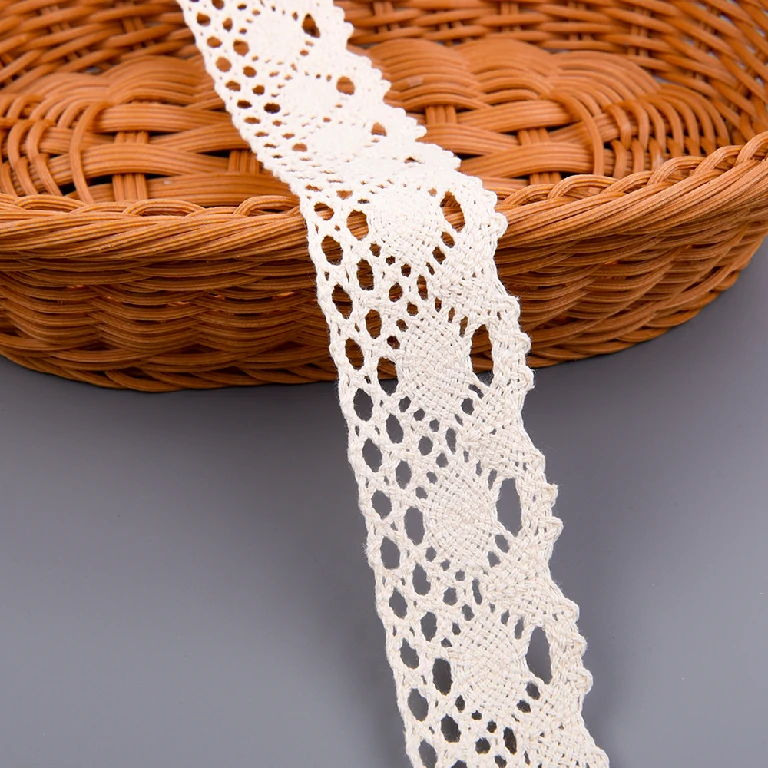 High-quality flower crochet lace trim in 100% cotton, available wholesale from factory with option to customize width for fashion garment use.