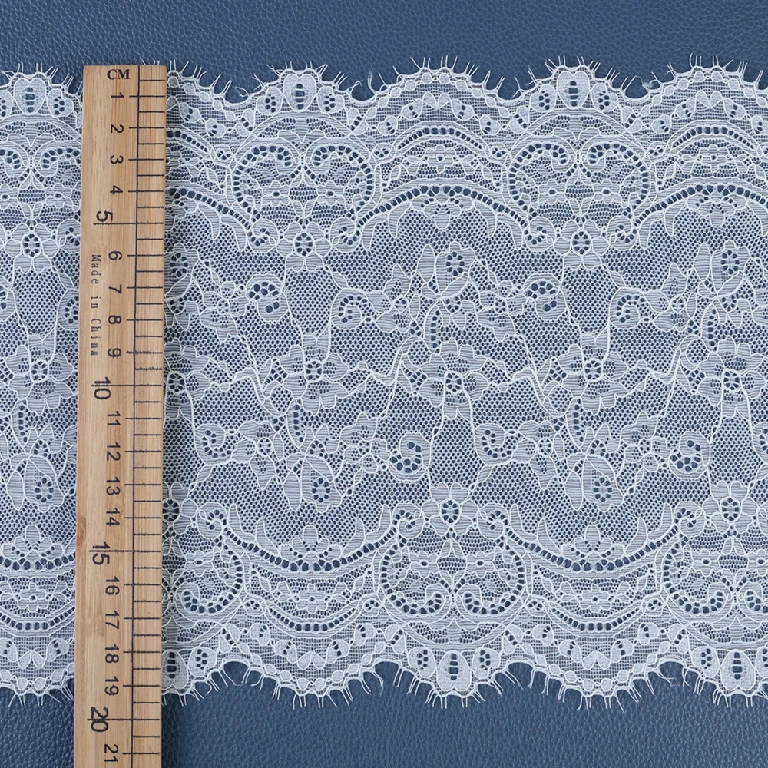 Soft and flexible mesh lace trim composed of nylon and spandex blend