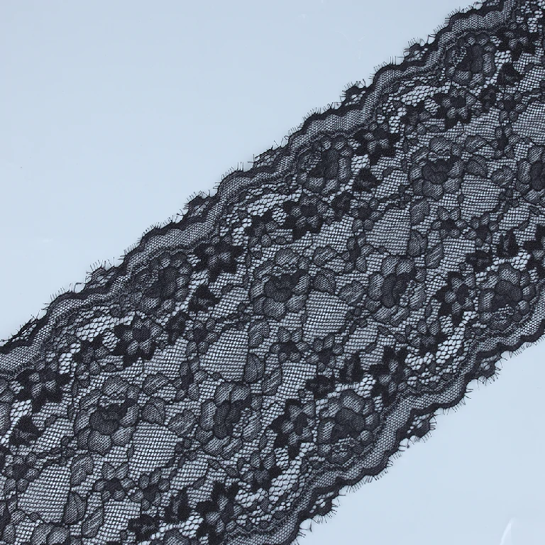 Close-up of black eyelash lace edged with fine eyelash fringes