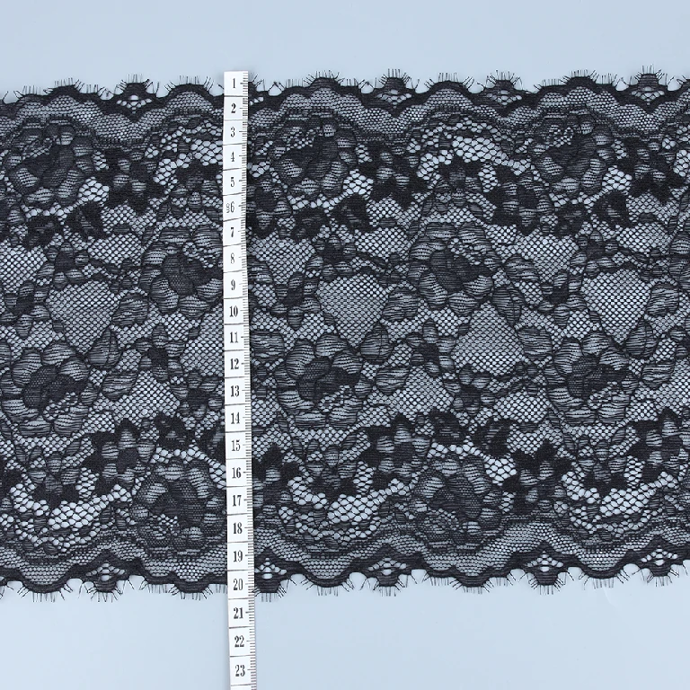 Black eyelash lace trim with intricate floral and wave patterns