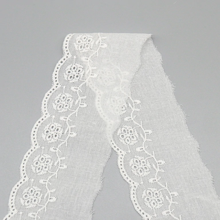 High-end embroidered cotton lace trim in premium quality, available for wholesale bulk orders with custom factory designs for multi-purpose use.