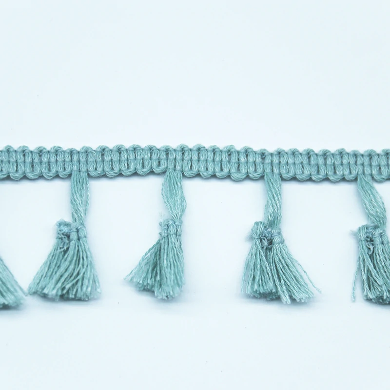 Detail of braided gimp header band construction showing secure sewing edge.